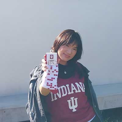 Image of Hang Doan holding luddy socks