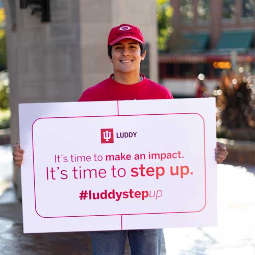 Jaiden Medina holding a Step up Campaign sign